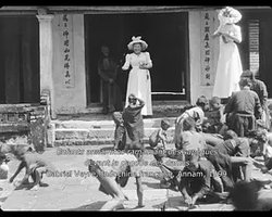 Indochina: Children Gathering Coins Scattered by Western Women